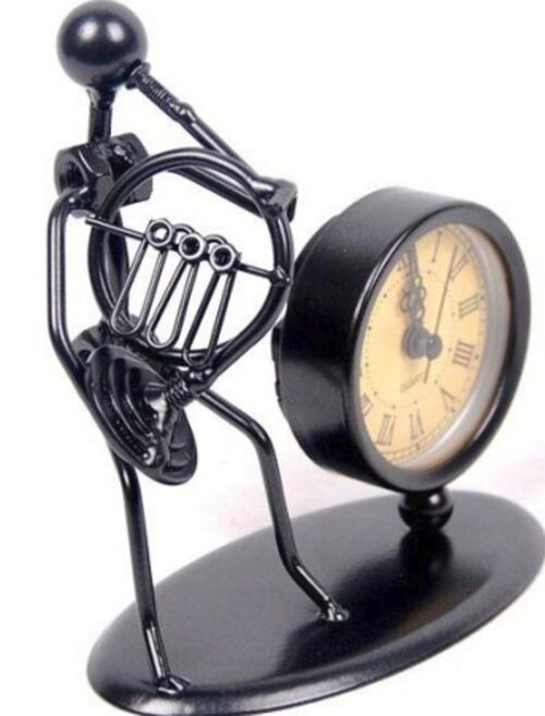 Escultura con reloj Corno francs